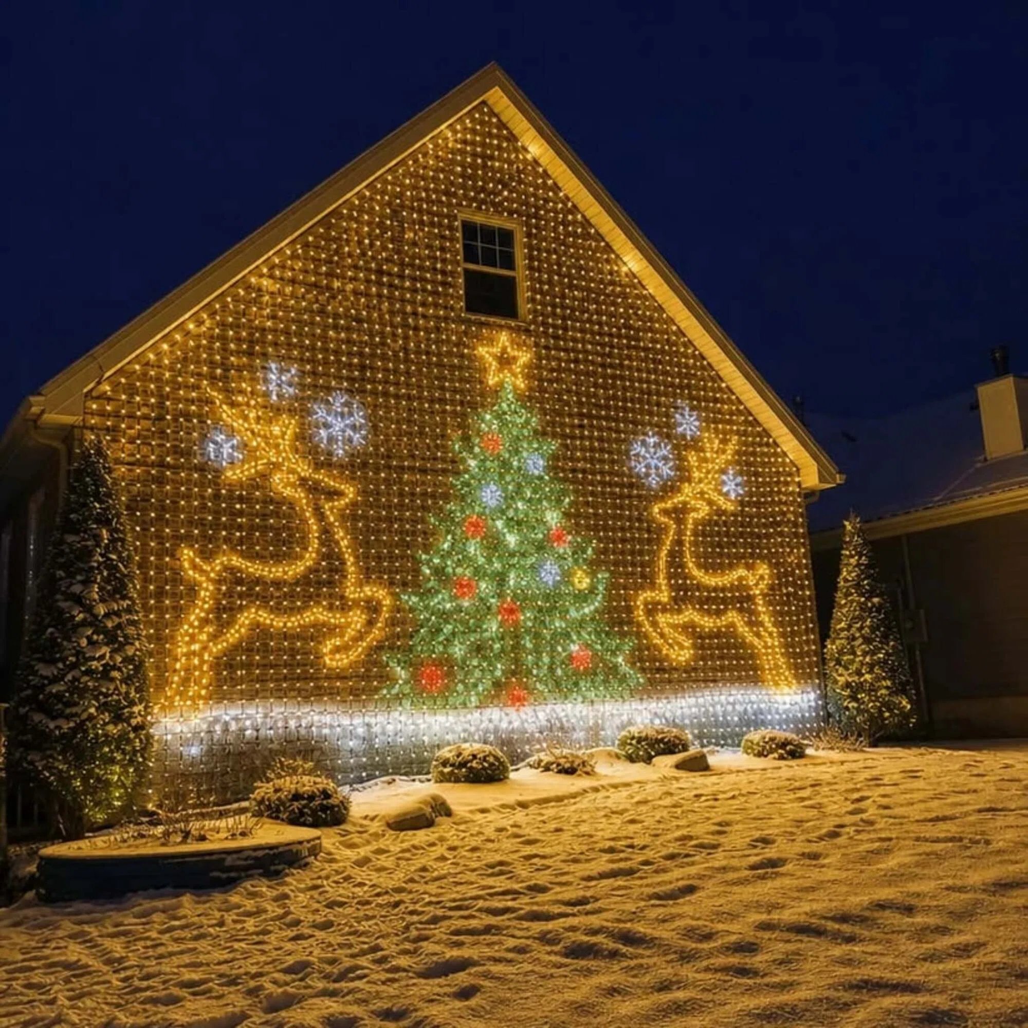 LED curtain showing a Christmas tree, reindeer and snowflake pattern