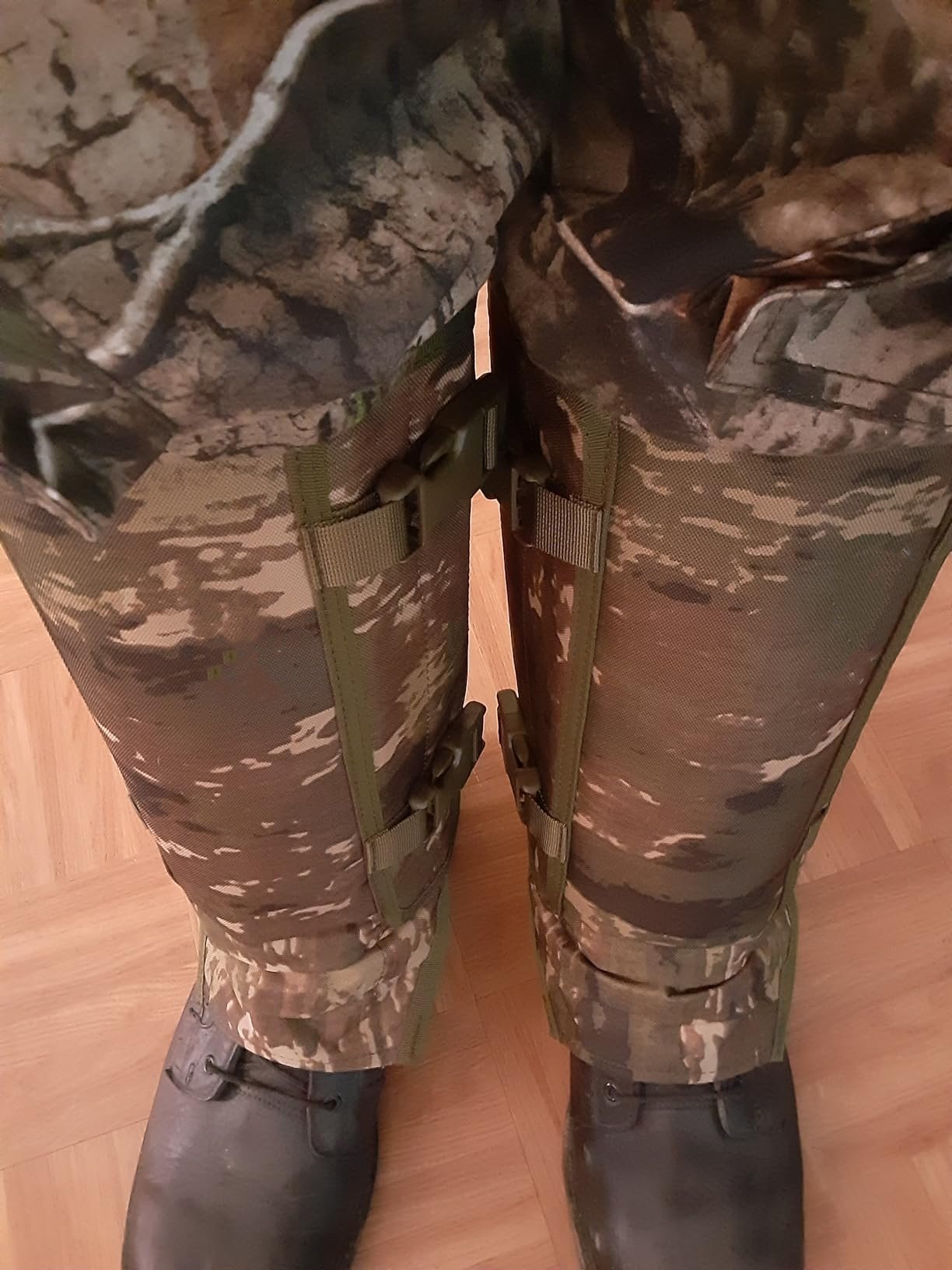 Customer wearing protective snake gaiters for outdoor work