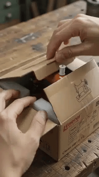 Portable mini sewing machine in use