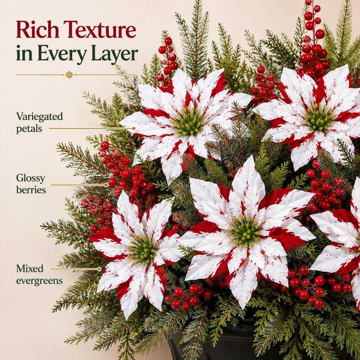 Red and white poinsettias with berries and evergreen foliage