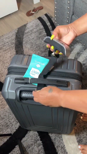 Portable digital luggage scale in use