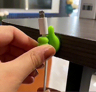 Thumbs up wall hook in use
