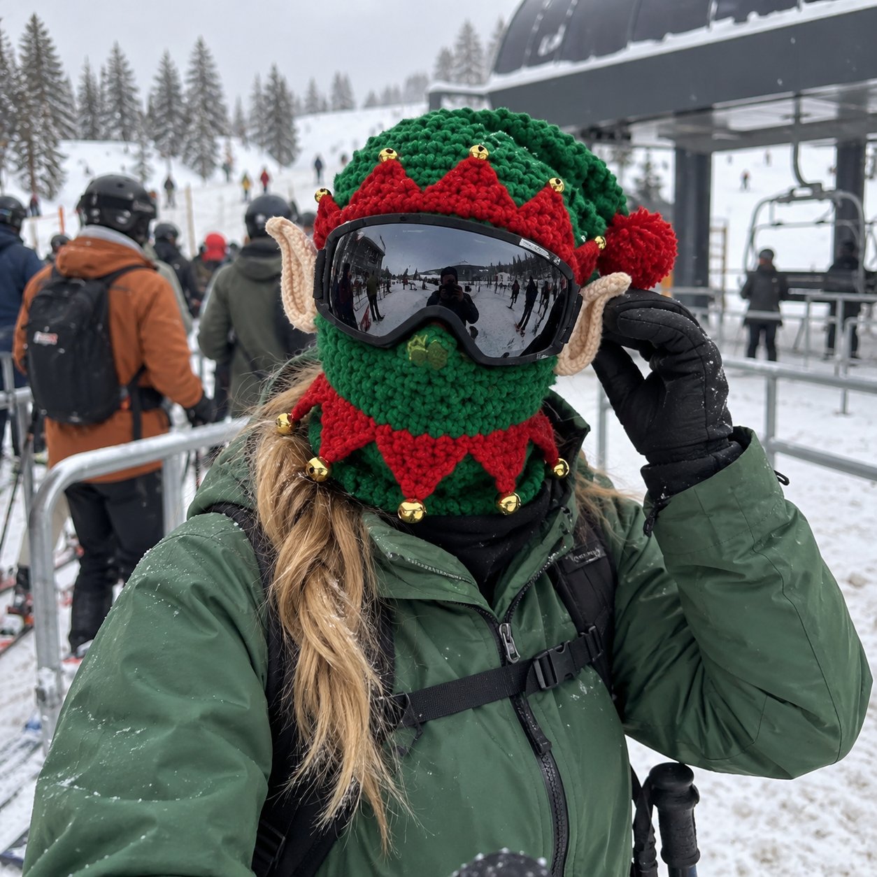 Customer photo of a green Elf mask worn with goggles beside a ski lift