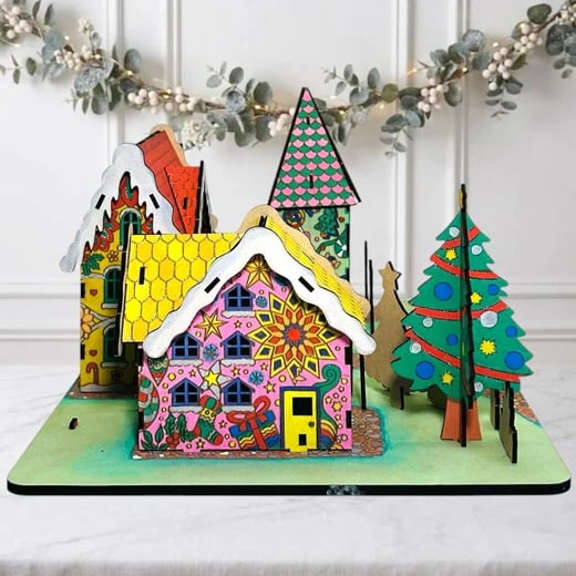 Painted gingerbread house with a pink roof