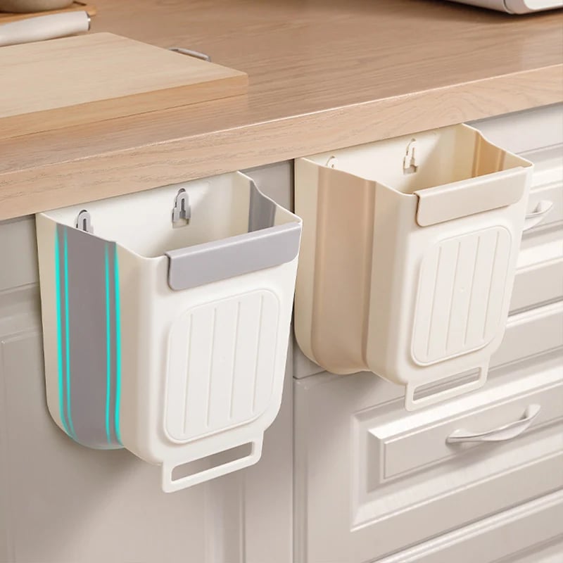 Hanging collapsible trash can mounted on a kitchen cabinet door