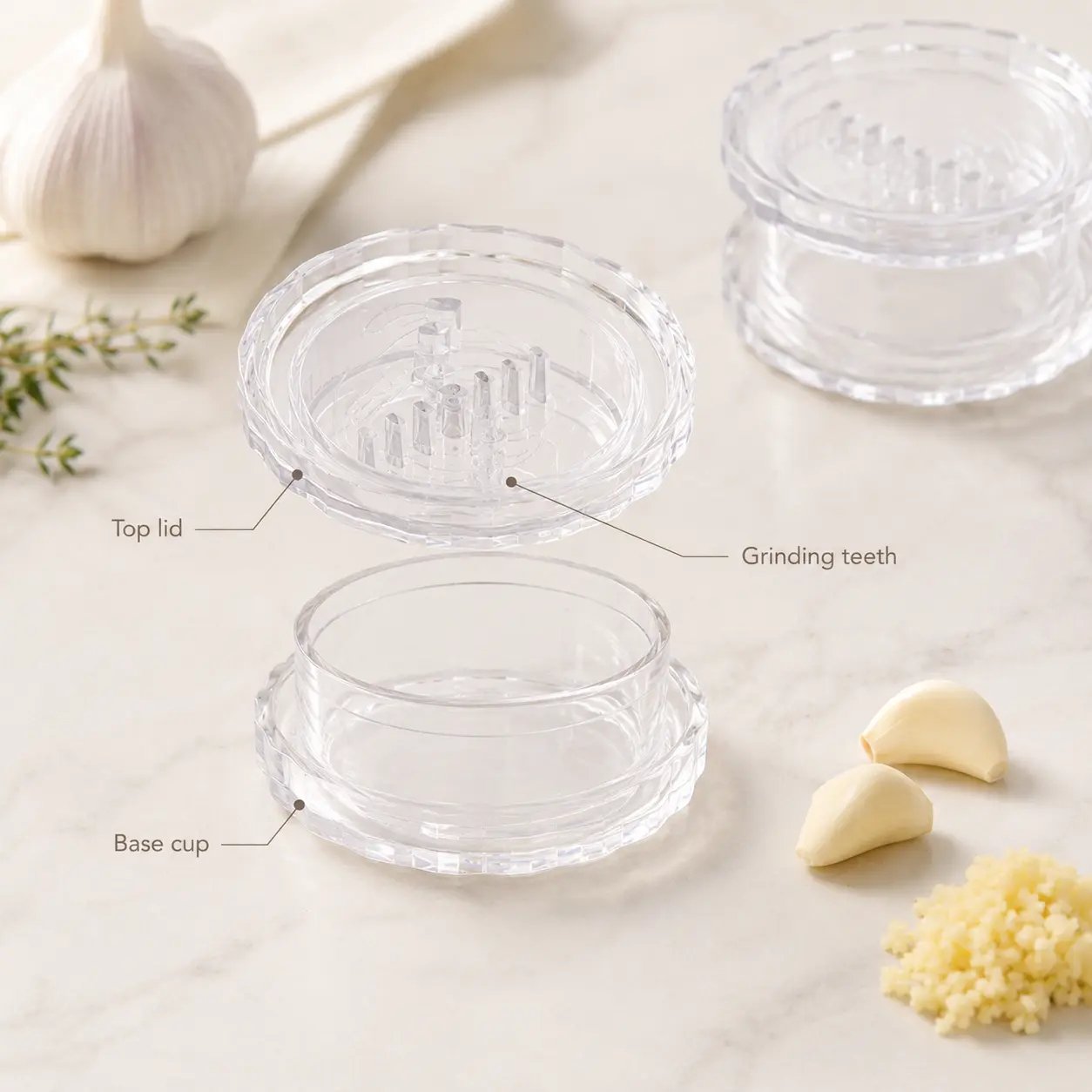 Garlic twister product breakdown showing top lid, grinding teeth, and base cup